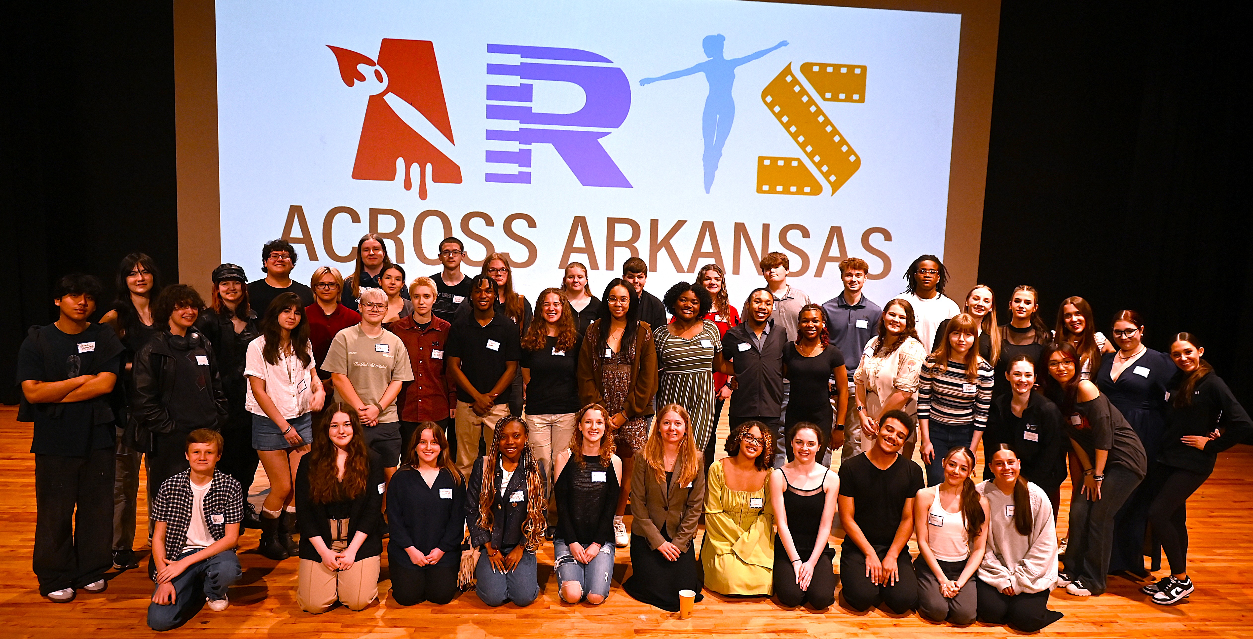 About 55 high school students pose during Arts Across Arkansas.