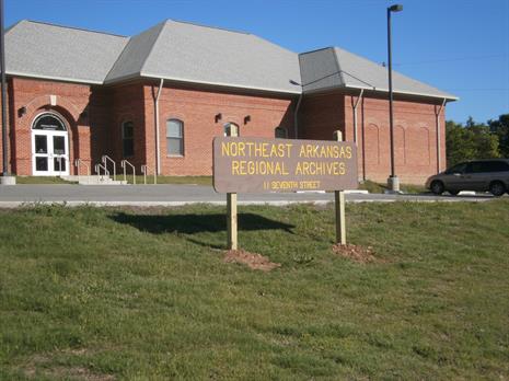 brick building with grass in front