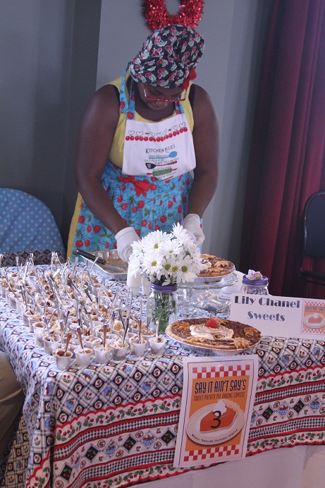 woman standing with desserts